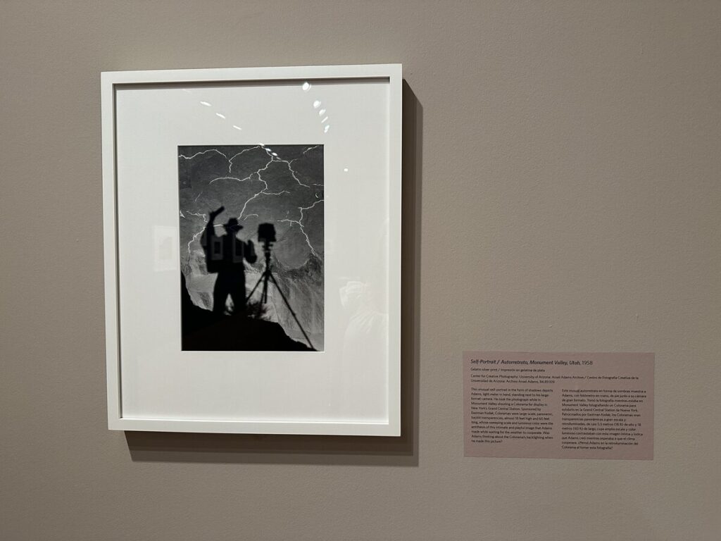 Ansel Adams black-and-white self-portrait showing his shadow beside a tripod in Monument Valley, Utah.