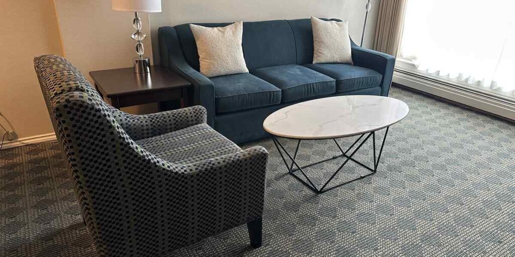 Living room in a spacious suite at Chateau Victoria Hotel & Suites in Victoria, BC.