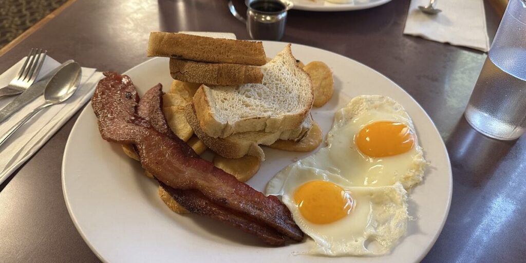 Large breakfast of eggs, bacon, potatoes and toast at Floyd’s Diner in Victoria.