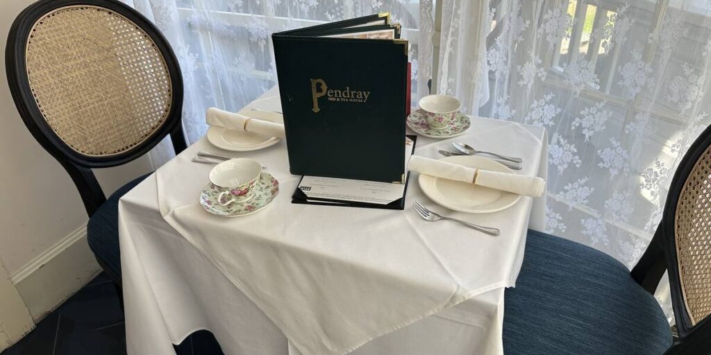 Elegant table setting with floral china at Pendray Inn & Tea House in Victoria.