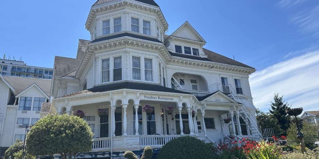 Historic white Victorian mansion housing Pendray Inn & Tea House in Victoria, BC.