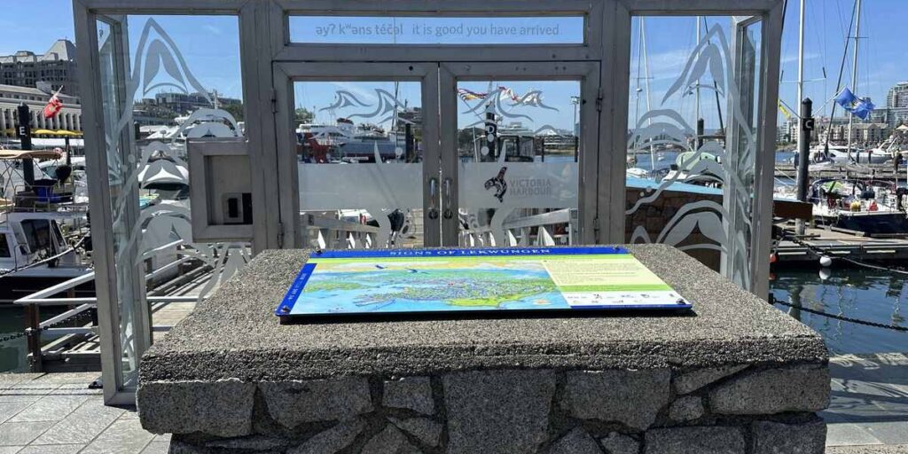 Signs of Lək̓ʷəŋən interpretive map beside Victoria’s Inner Harbour marina.