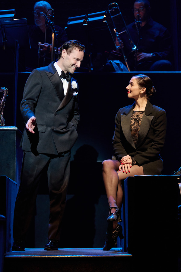 Max von Essen as Billy Flynn stands beside Reece Weaver as Roxie Hart.